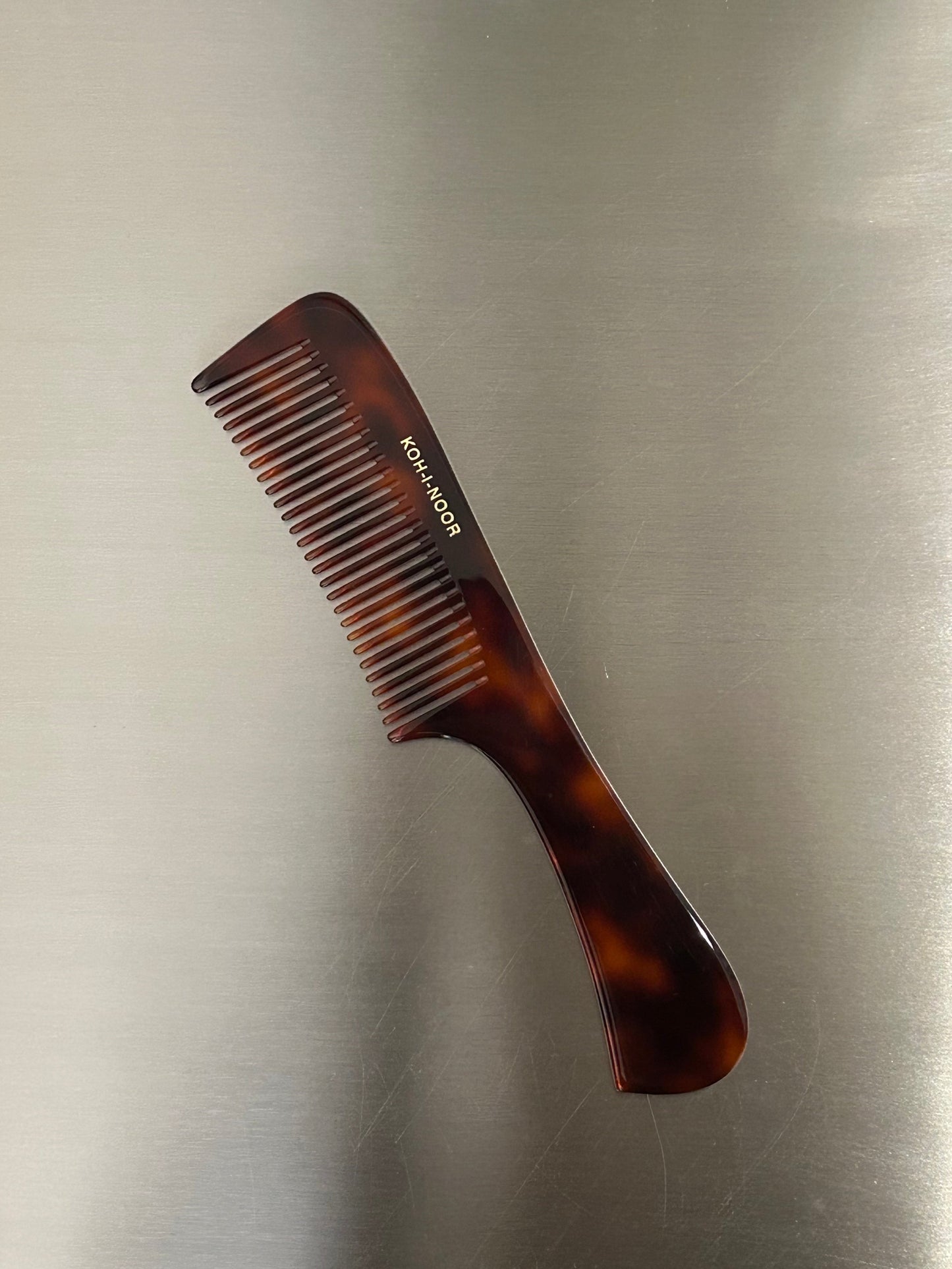 Comb with handle in tortoiseshell