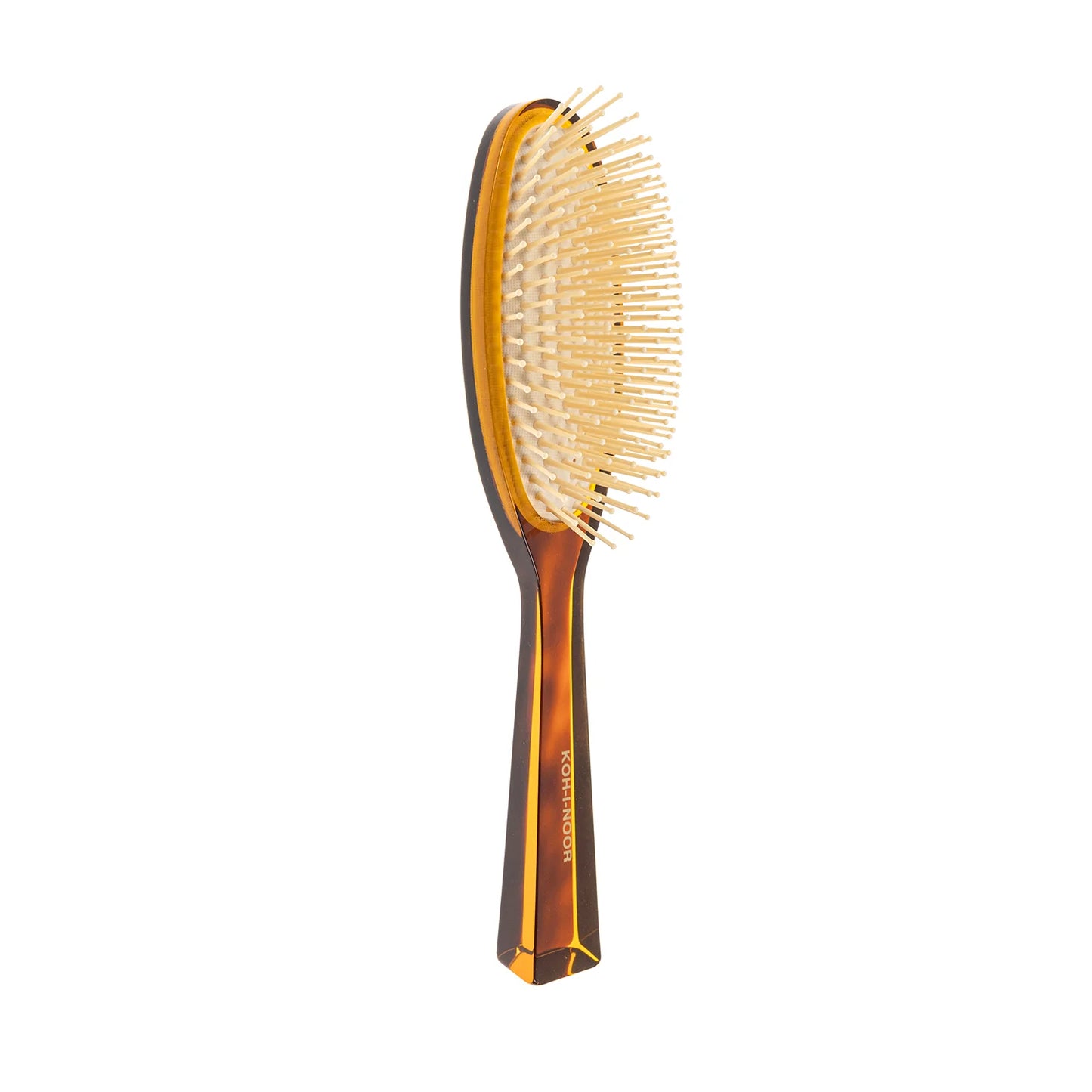 Hair brush with plastic bristles