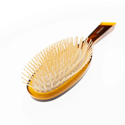 Hair brush with plastic bristles