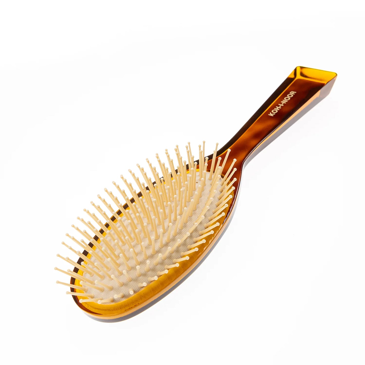 Hair brush with plastic bristles